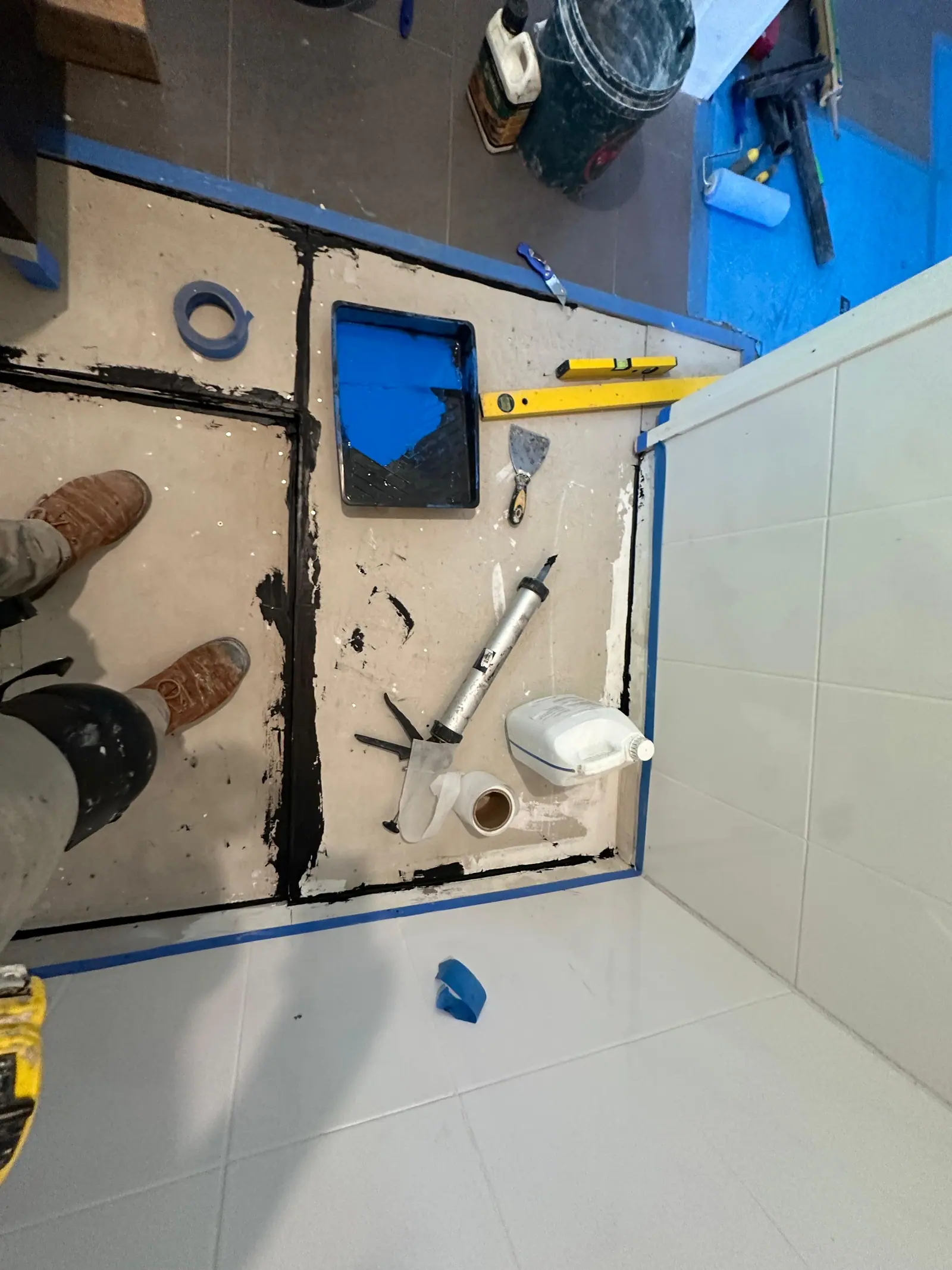 Shower base prepared and screeded to falls before waterproofing