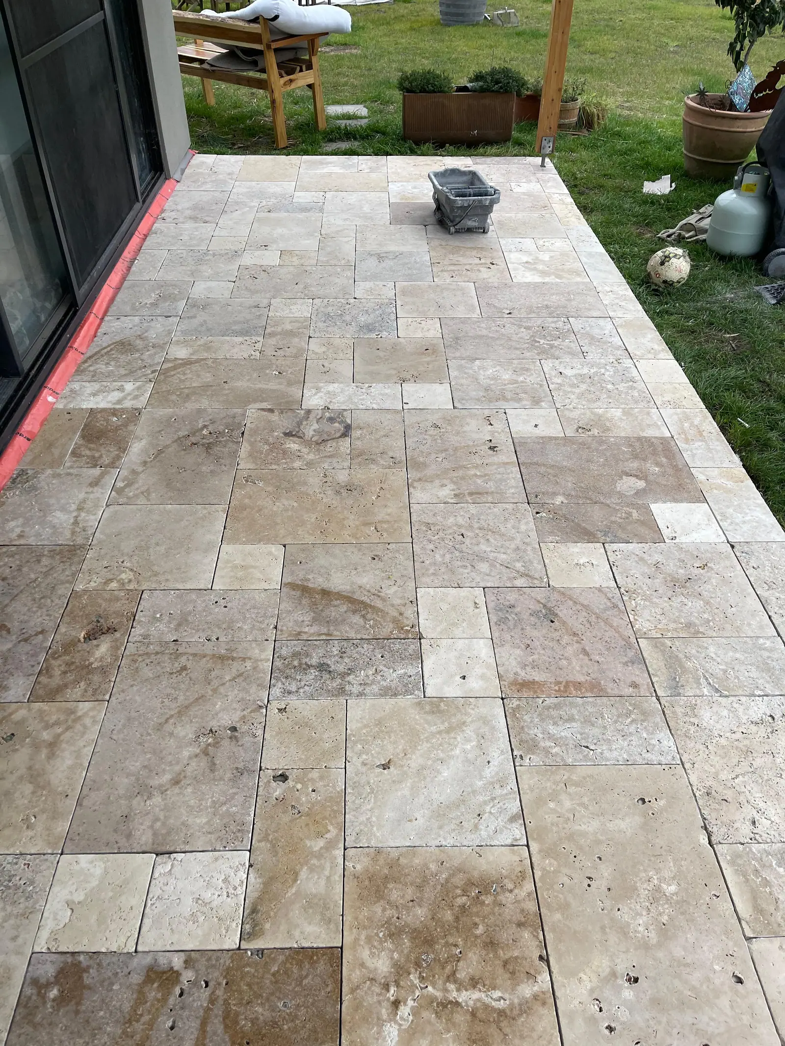 Completed French pattern stone paving across an outdoor area